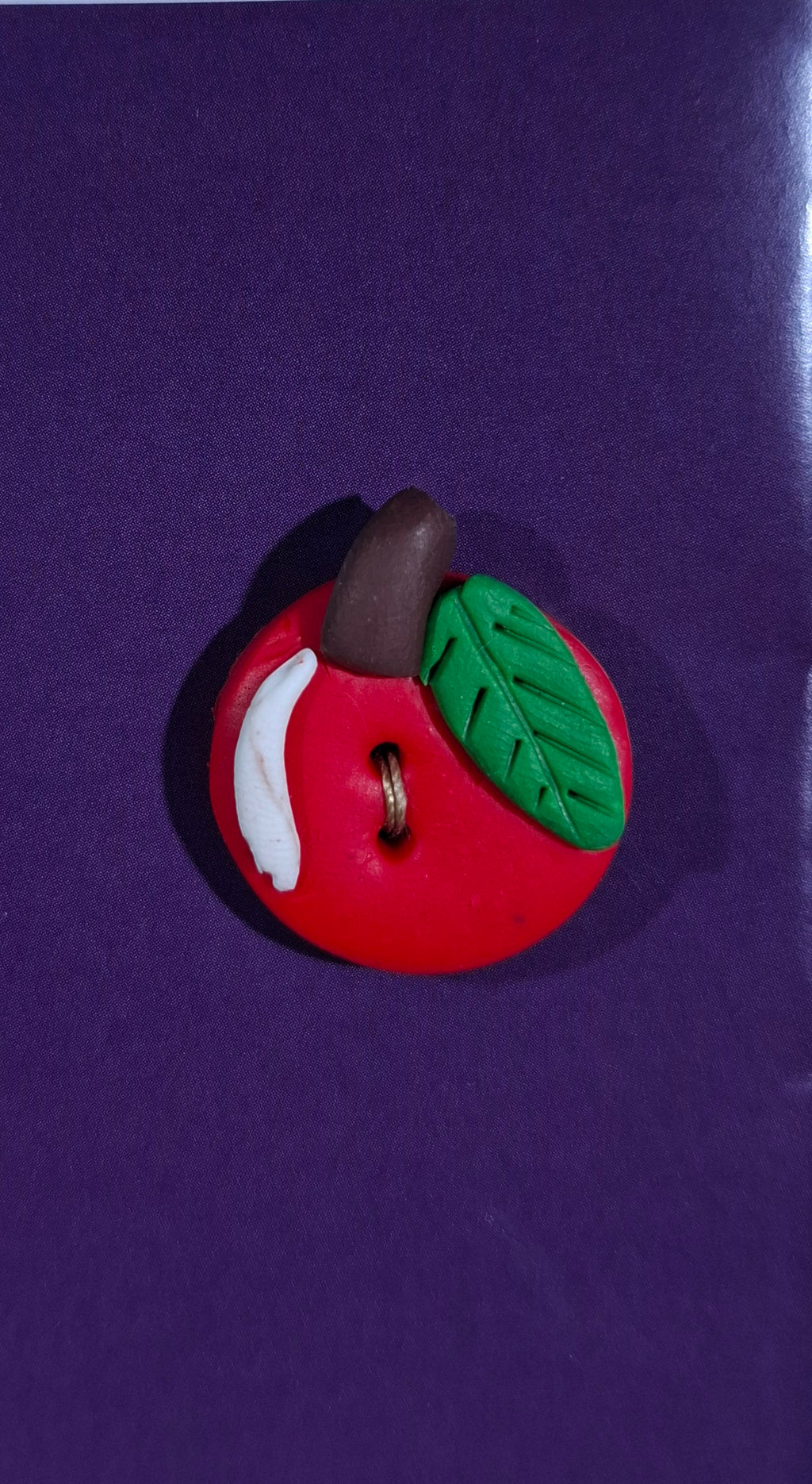 Red apple button